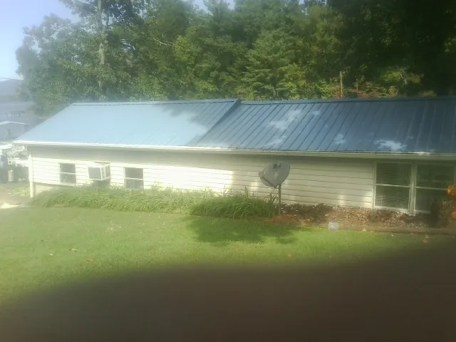 Blue metal roof running the length of a single story home in Martinsville
